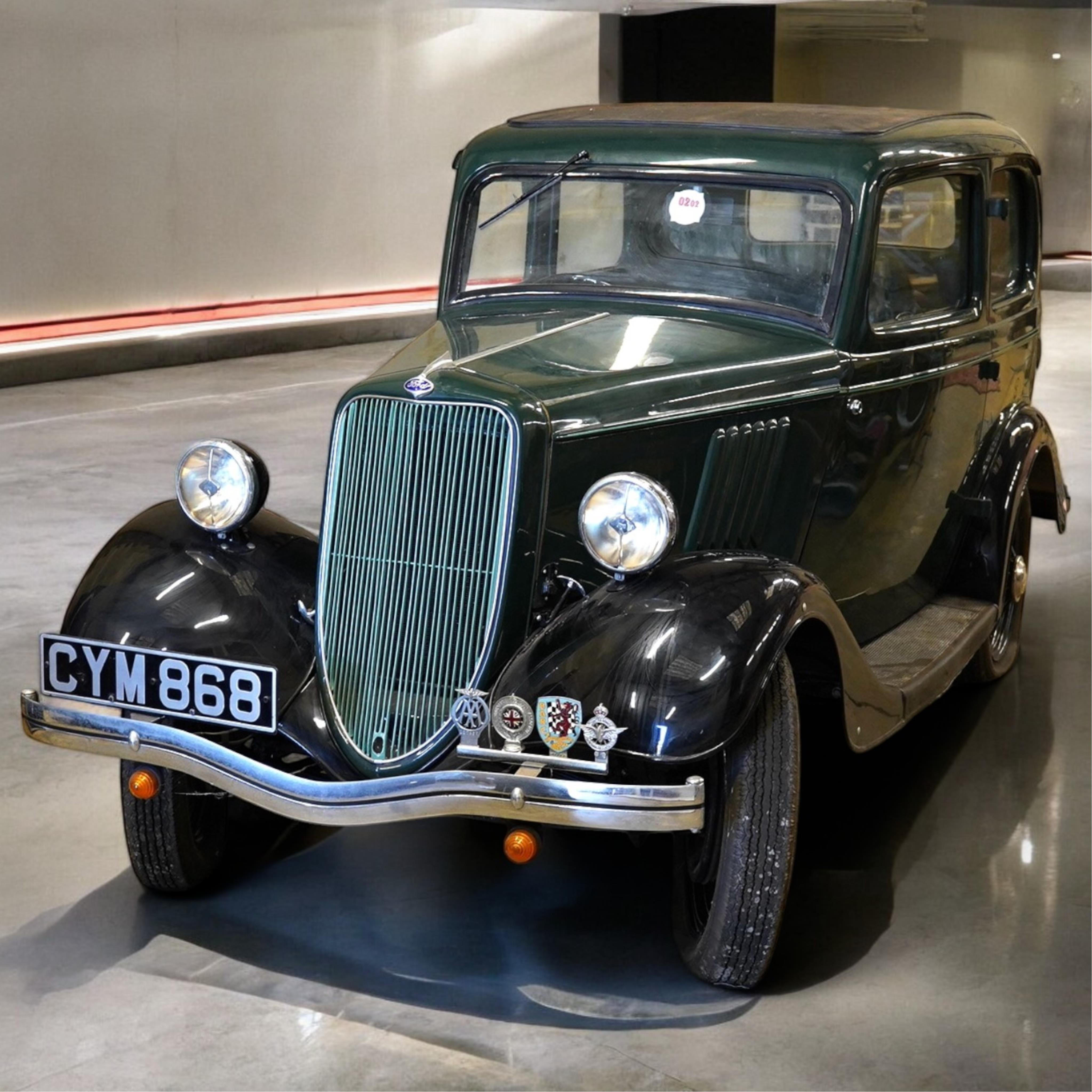 A 1936 Ford Model Y saloon, reg. no. CYM868, 885cc, dark green, odometer showing 93,057 miles. Restored by the late owner, to a very high standard and winner of seven Concours d’Elegance awards
